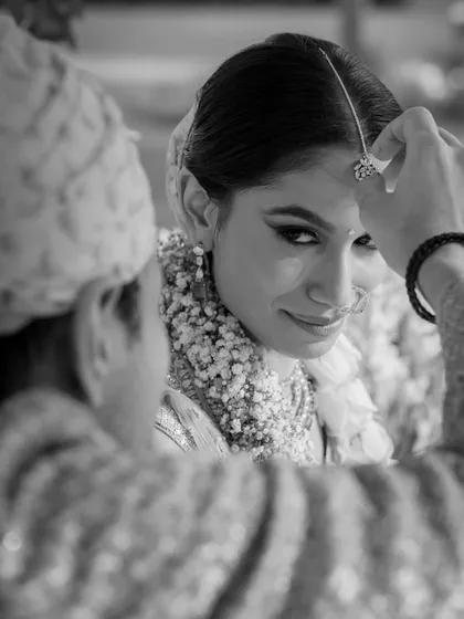 Sid touches the tip of Saumya’s forehead with sindoor. The intensity in her eyes as she looks at him makes this a powerful and intimate moment, marking the completion of their wedding ceremony.