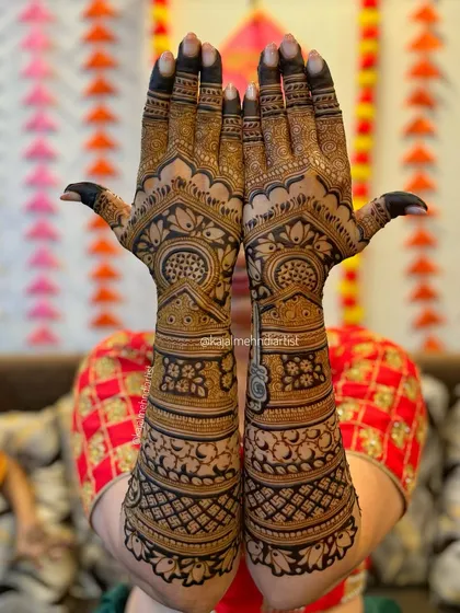 A beautiful shot of a full bridal backhand design, held up against a festive background. The symmetry is just perfect.