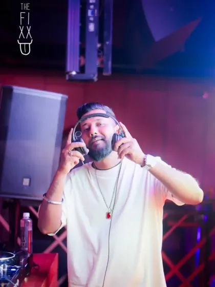 Listening closely to the mix. Ensuring perfect sound quality is key to a great set.