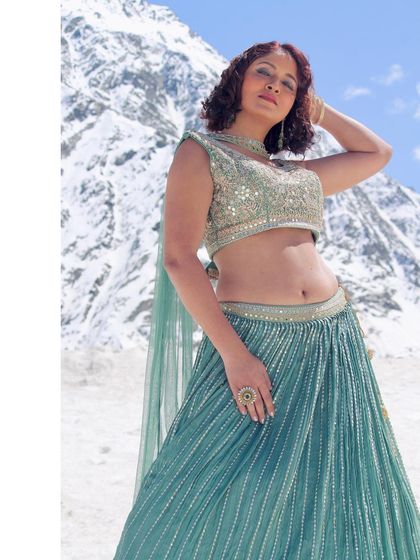 A closer look at the sequined blouse and the model's confident expression.