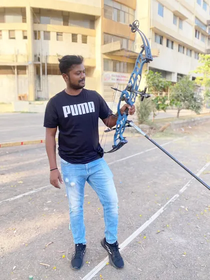 Our coach with his new Hoyt Stratos compound bow. We believe in using the best equipment to achieve the best results.