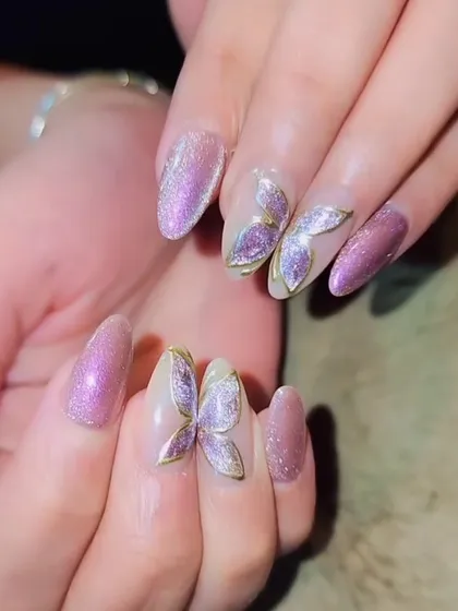 Taking nail art to the next level with these incredible 3D butterfly accents. Set against a sparkling pink cat eye base, these butterflies are crafted with detail and care, creating a truly show-stopping look.
