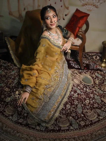 A full-length shot of the bride, showcasing her magnificent lehenga and the way the makeup complements it.