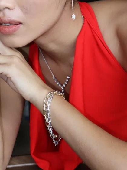 A layered wrist stack featuring a diamond link bracelet, paired with the delicate Y-shaped diamond necklace.