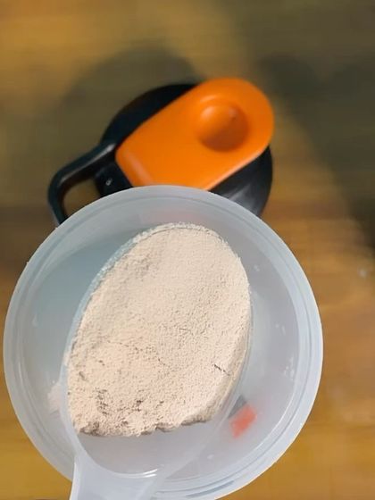 A scoop of whey protein powder. A simple but effective tool in my nutrition arsenal to ensure I hit my daily protein targets.