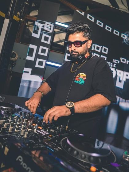 A focused shot of me working the mixer at FLO. Every button and knob has a purpose.