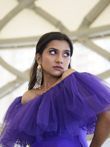 A detailed shot highlighting the creative makeup accents. I added a few small rhinestones near the eye to catch the light and add a touch of unexpected sparkle, elevating this lookbook photo.