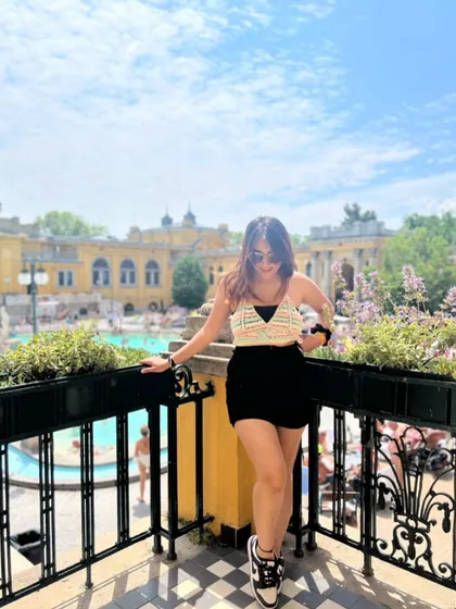 A shot from Budapest, wearing a crochet top. This highlights my versatile summer travel style.