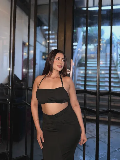Another angle of the black two-piece set, showing its flattering fit.