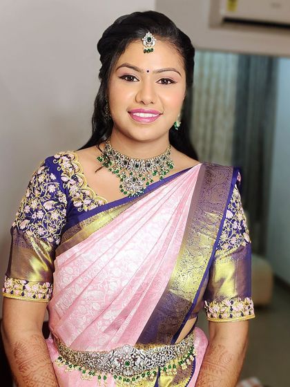 Our client Sneha looks lovely in this Victorian-style choker set with green stones. It's a versatile piece that can be dressed up for a reception or worn for a smaller family function.