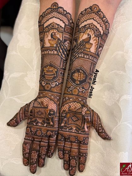 A beautiful bridal design focusing on the grace of peacocks and the strength of elephants. The patterns are dense and symmetrical, creating a stunning effect without any human figures.