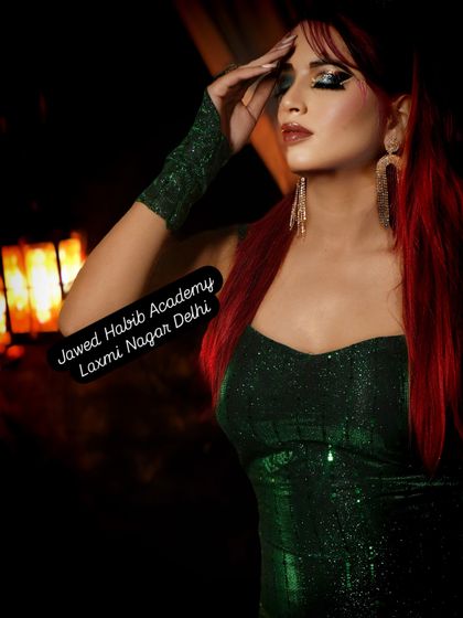 A powerful and edgy look with vibrant red hair and a dark, glamorous outfit. Our courses encourage students to experiment with bold and unconventional styles.