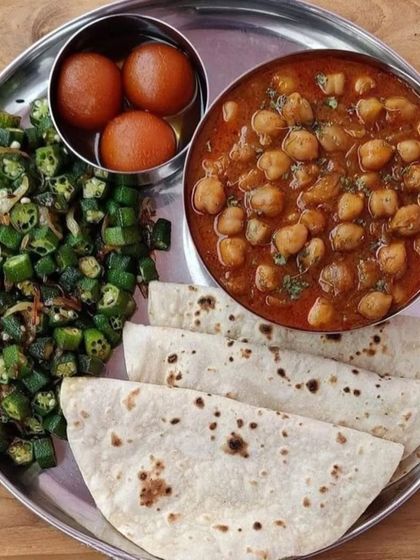 A simple and soulful meal of chole, bhindi fry, and soft rotis, with gulab jamun for dessert. This is the kind of nourishing food that warms the heart.