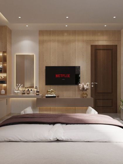 For those who like it minimal, light, yet classy. This bedroom design features a built-in vanity and dressing area with integrated lighting, clean lines, and a neutral color palette, creating a space that is both highly functional and elegantly simple.