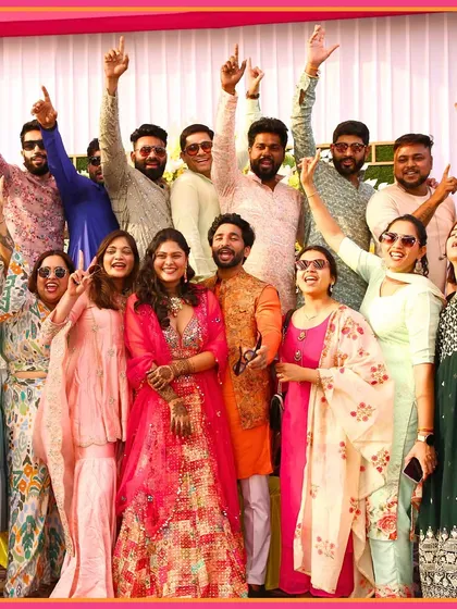 A group photo of the couple with their friends at the Mehendi. It's all about celebrating with your loved ones.