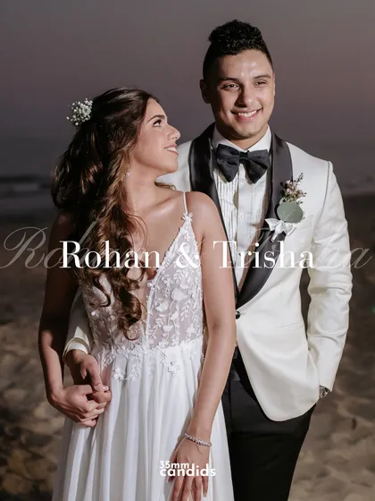 A classic portrait of Rohan and Trisha on the beach at dusk. The warm light and their happy expressions make for a timeless wedding photo.
