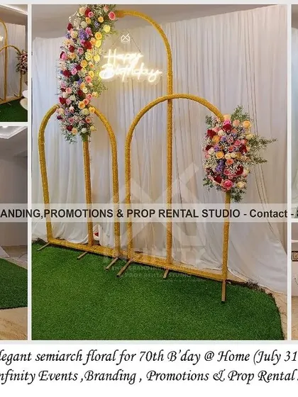 We believe every milestone is worth celebrating in style, like this elegant 70th birthday at home. We designed a sophisticated backdrop using golden semi-arches adorned with beautiful, fresh floral arrangements and a "Happy Birthday" neon sign, complemented by large marquee numbers to mark the special occasion.