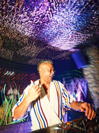 Giving a thumbs-up from the DJ booth in Mumbai. It is all about good vibes and positive energy.