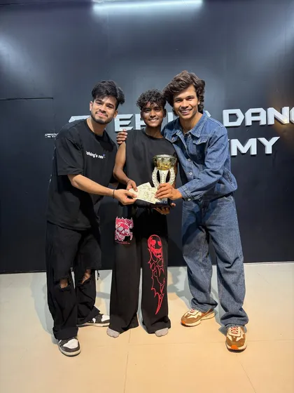 Presenting the trophy and cash prize to one of our internal competition winners. This is the result of pure hard work.