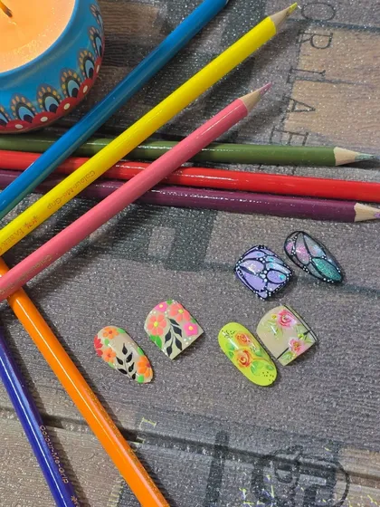 A beautiful collection of matching floral and butterfly designs for fingers and toes, created in my workshop.