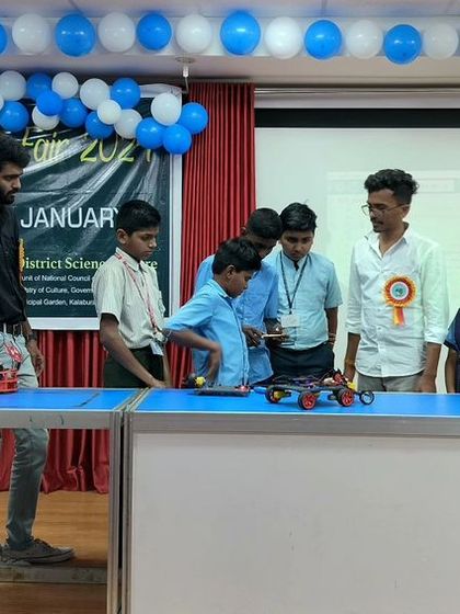 A group of curious students gets a close-up look at the robots on display at our Innovation Fair booth. Hands-on exploration is the best way to learn.