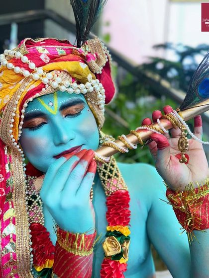 A stunning Krishna-inspired look for Janmashtami, showcasing full-body paint and intricate details.