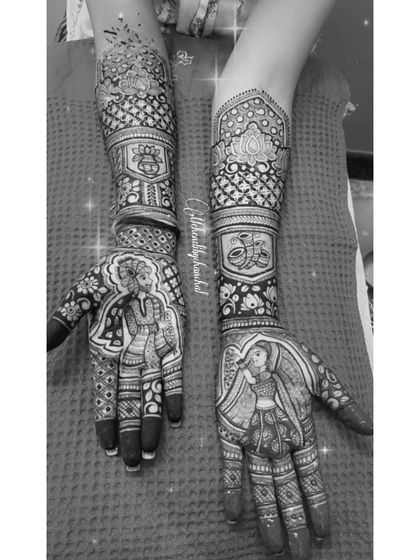 A black and white shot of a bridal design, highlighting the contrast and detail in the bride and groom portraits.