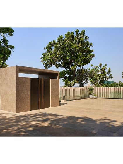 The outdoor patio space was repaved and redesigned to be more functional and aesthetically pleasing, with a new entrance structure providing a sense of arrival.