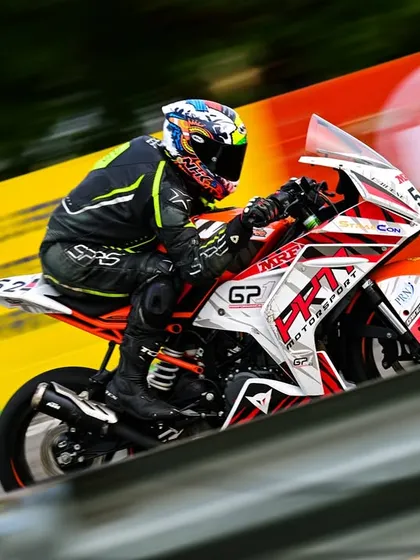A motion-blur shot of Swaroop at speed, conveying the sheer velocity and intensity of national-level racing.