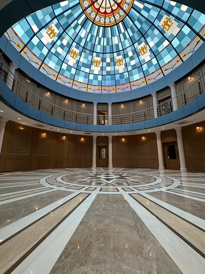 The completed reception lobby at Arihant Aspire, featuring the largest stained-glass dome in Mumbai. This three-story high space is a testament to our ability to execute large-scale, complex architectural features that become true landmarks.