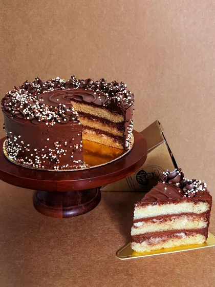 My Wannabe Chocolate Cake, now available by the slice on Swiggy and Zomato. It's a moist vanilla sponge with the most decadent chocolate buttercream. It's egg-free, but you'd never believe it.