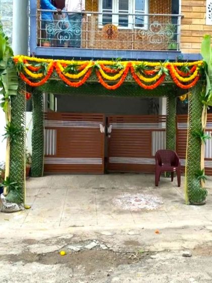 A traditional 'Chappara' decoration for a housewarming. This entrance structure is made from coconut leaves and decorated with marigold flower garlands.