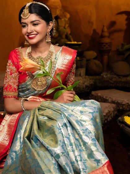 A serene and beautiful bridal portrait. The combination of the stunning saree, intricate jewelry, and my classic makeup artistry creates a truly timeless look.