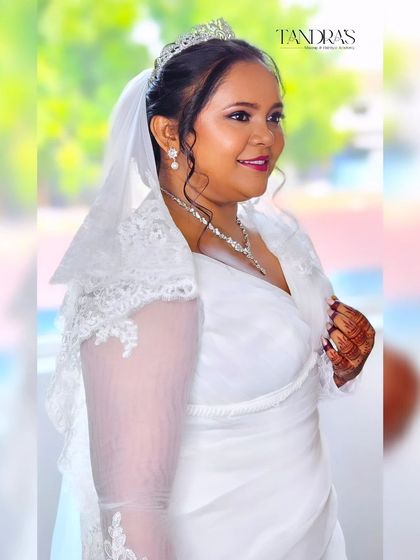 A side profile of the beautiful bride Monica, looking radiant on her wedding day.