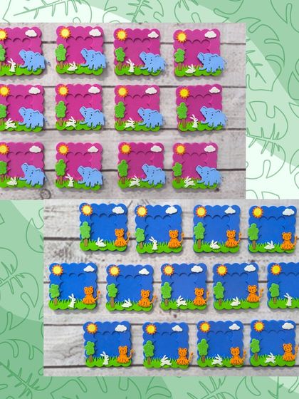 A closer look at the elephant and tiger-themed foam photo frames. The bright colors and cute designs make them a cheerful keepsake.