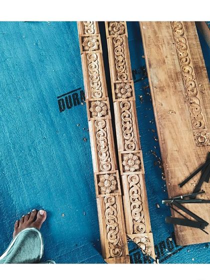 A detail shot of the hand-carved wooden elements before installation. This image from our 'Craftsman Tales' series highlights the precision and artistry that goes into every piece of woodwork in our projects.