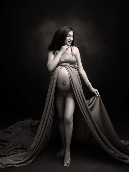 A goddess in her own right. This black and white portrait captures strength and softness with a beautiful fabric drape.