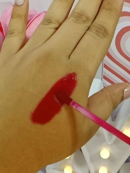 A swatch of my lip tint, showing its vibrant, natural color. It's the perfect blend of color and care.