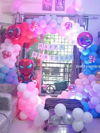 The Spiderman home party setup with party lighting to create a fun atmosphere.