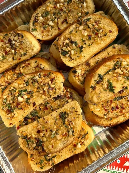 Freshly baked herbed butter garlic bread. It's the perfect accompaniment to my pasta dishes or delicious enough to be enjoyed on its own.