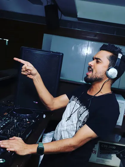 Pointing to the crowd, feeling the vibe. This is what it's all about, sharing the love for music and dance.