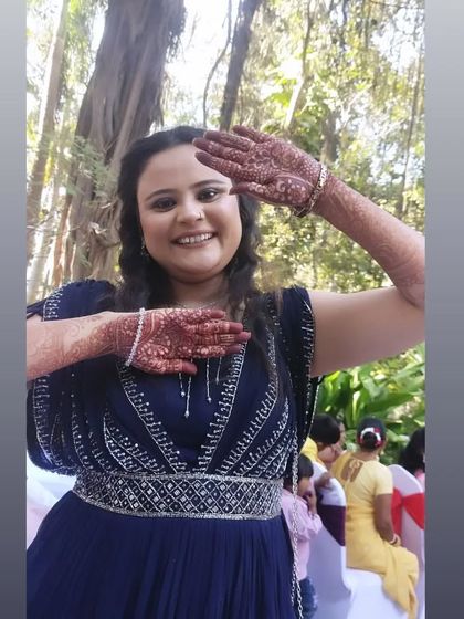 Another pose from a happy client, showing off her intricate henna. Her joy is the best feedback I can receive.