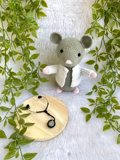 Dr. Mouse! This was a custom order for a graduation gift. The mouse is dressed in a doctor's apron with a tiny stethoscope and comes on a wooden base to be a display piece.