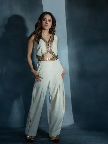 I styled Nushrratt Bharuccha in this elegant ivory co-ord set featuring an embroidered waistcoat and flared pants. It's a sophisticated take on fusion wear, ideal for a formal event.