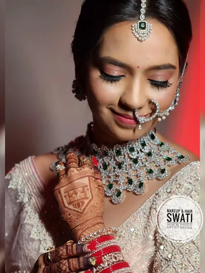 This shot beautifully captures the intricate henna design on Kshitija's hand, along with her stunning jewellery and soft makeup.
