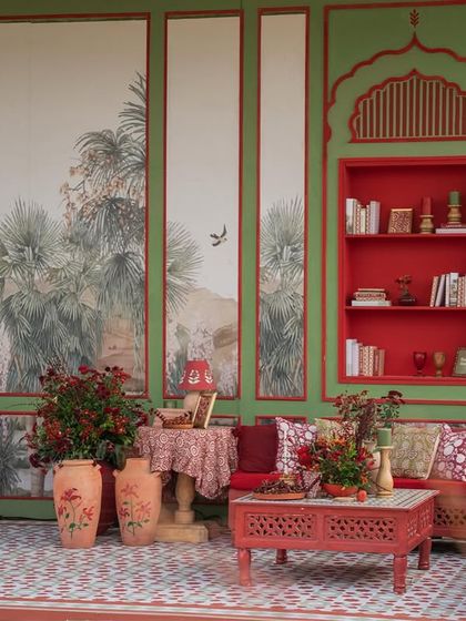 The full lounge structure, designed to resemble a royal pavilion. The hand-painted panels and jharokha-style shelves create an authentic and opulent atmosphere.