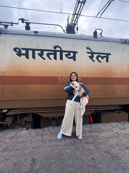 Posing with Pantu in front of an Indian Railways train.
