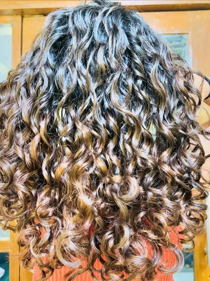 A collection of my other no-bleach balayage and color work, showcasing a variety of tones from subtle browns to vibrant reds on different curl types.