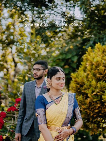 A beautiful portrait of a couple from their ring ceremony, captured in a lovely outdoor setting.