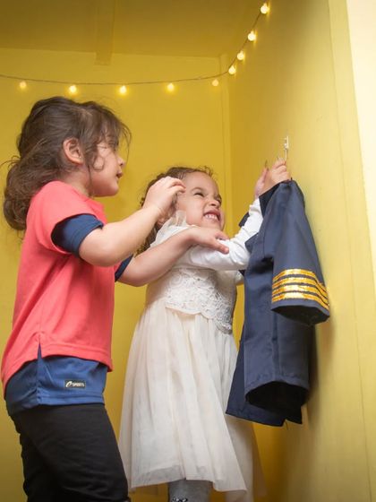 "Let's be pilots!" Friends helping each other choose costumes is a heartwarming sight in our pretend play huts.